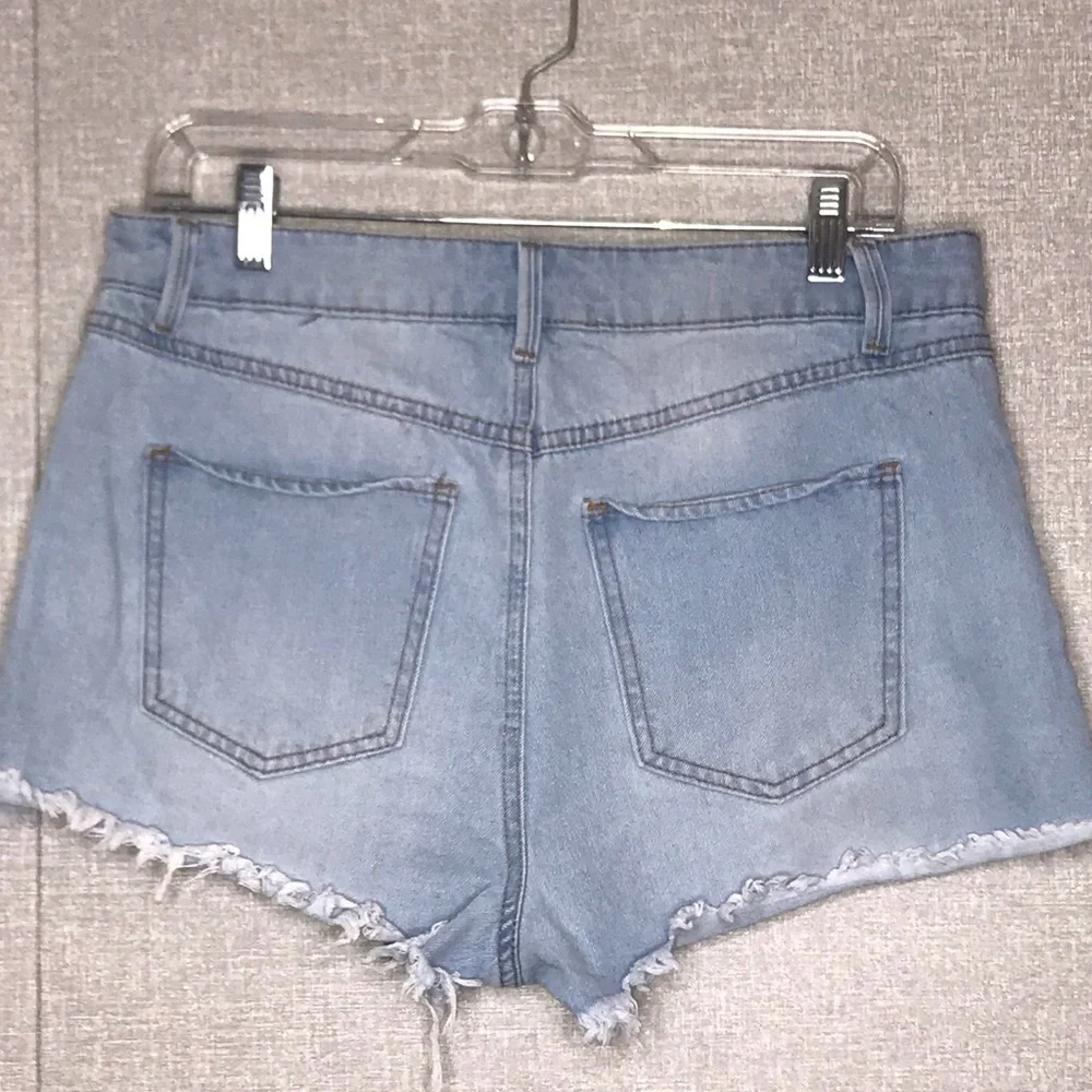 Rewash denim distressed